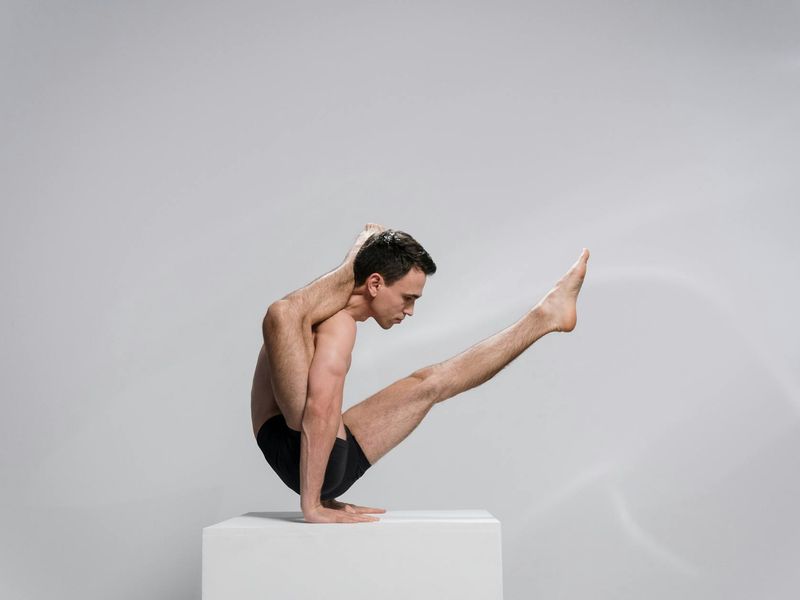 Man in a focused stance, demonstrating body control and stability.